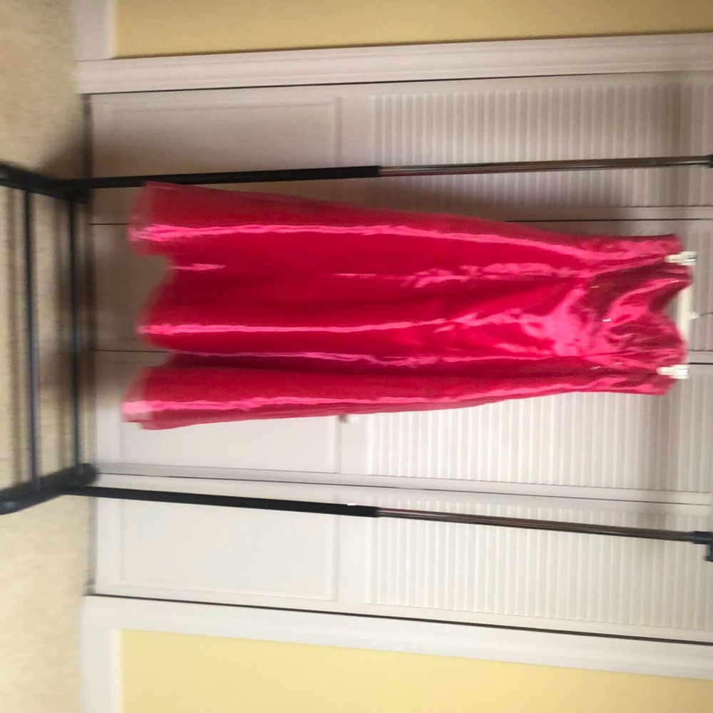 Prom dress in raspberry pink with silver sequins.Brand is Roberta in size 8-10